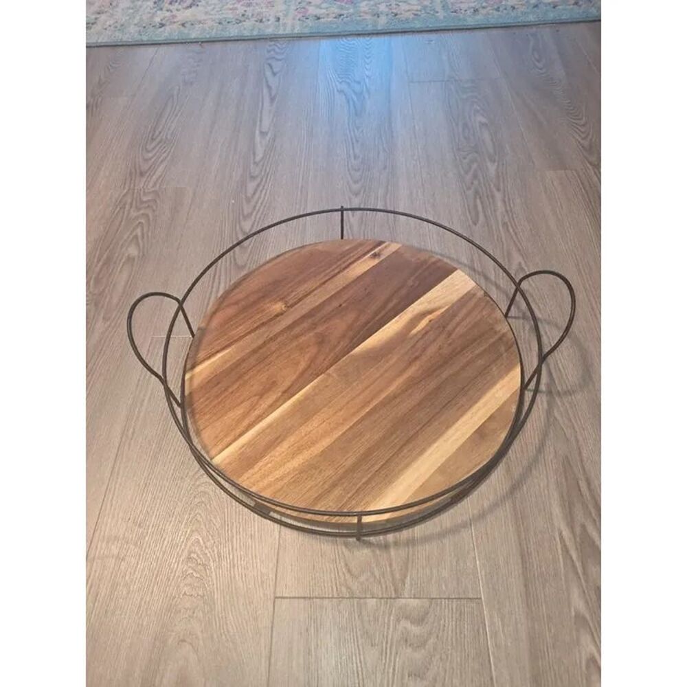 Acacia wood serving tray with black metal wire rim and handles, 16 inch diameter